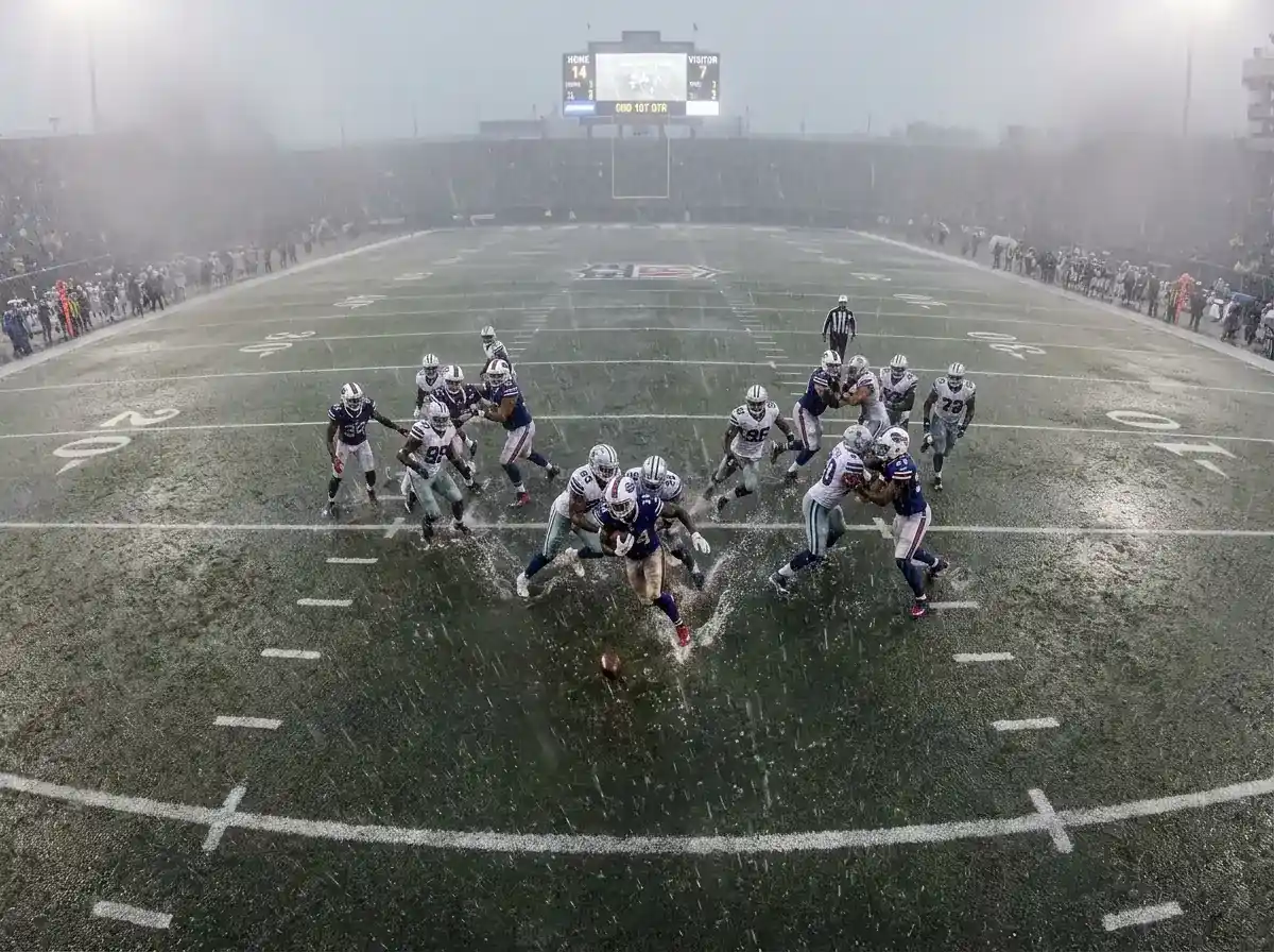 NFL-Spieler im Regen zeigt schlechte Wetterbedingungen als Einflussfaktor auf Over/Under Totals-Linie beim American Football